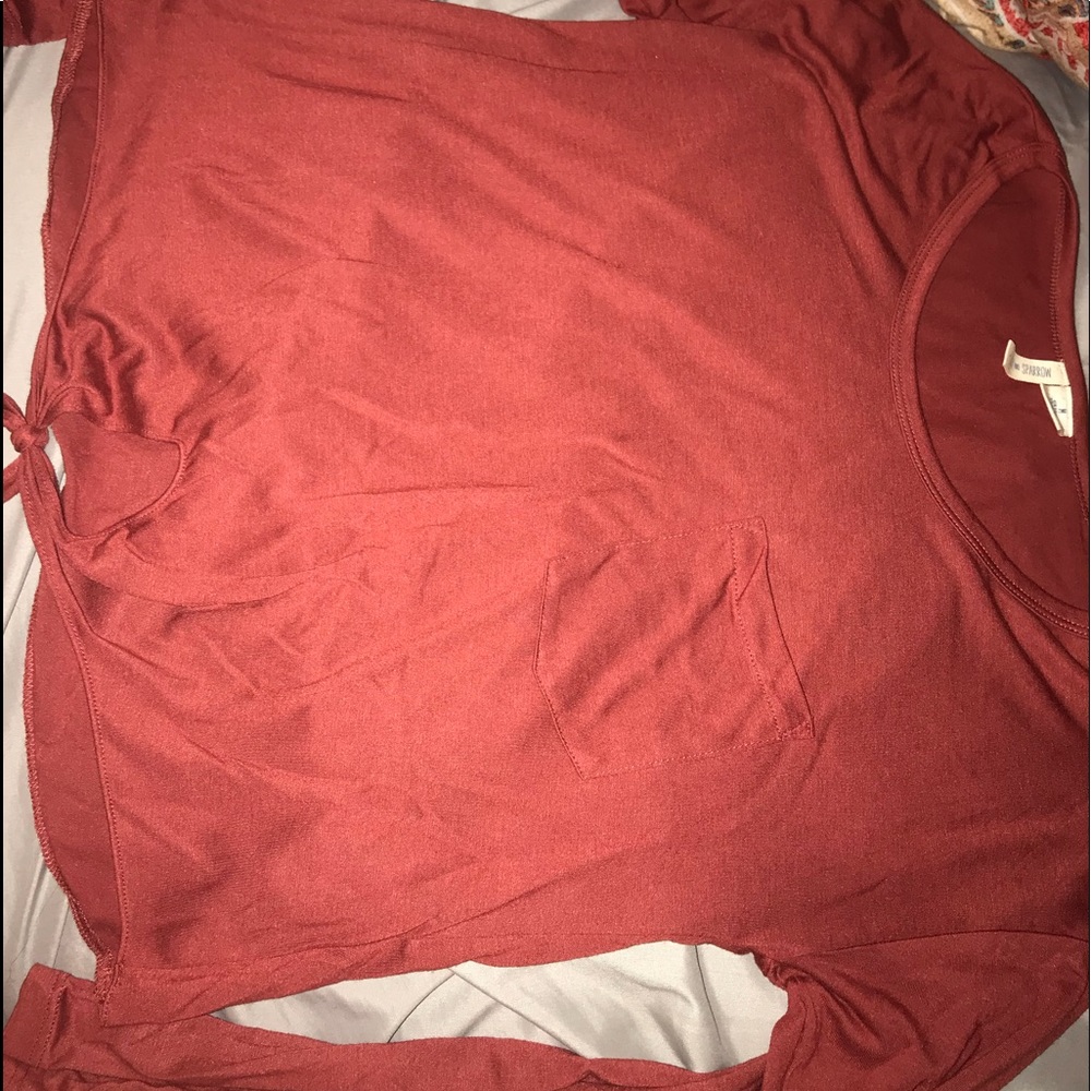 Long sleeve top with pocket and tied in front